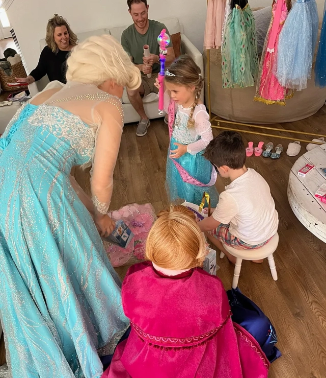 anna and elsa party with kids and happy parents