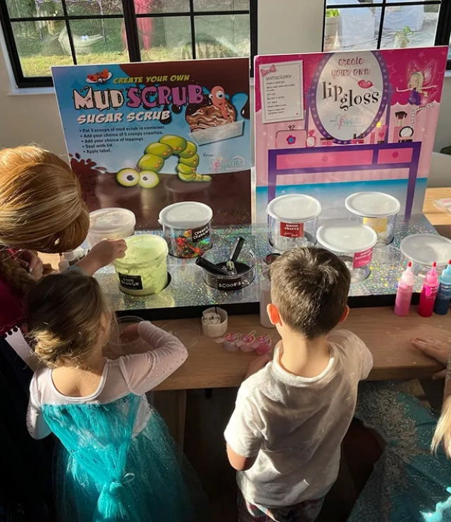 anna and elsa party with kids at fun stations mud scrub and lip gloss