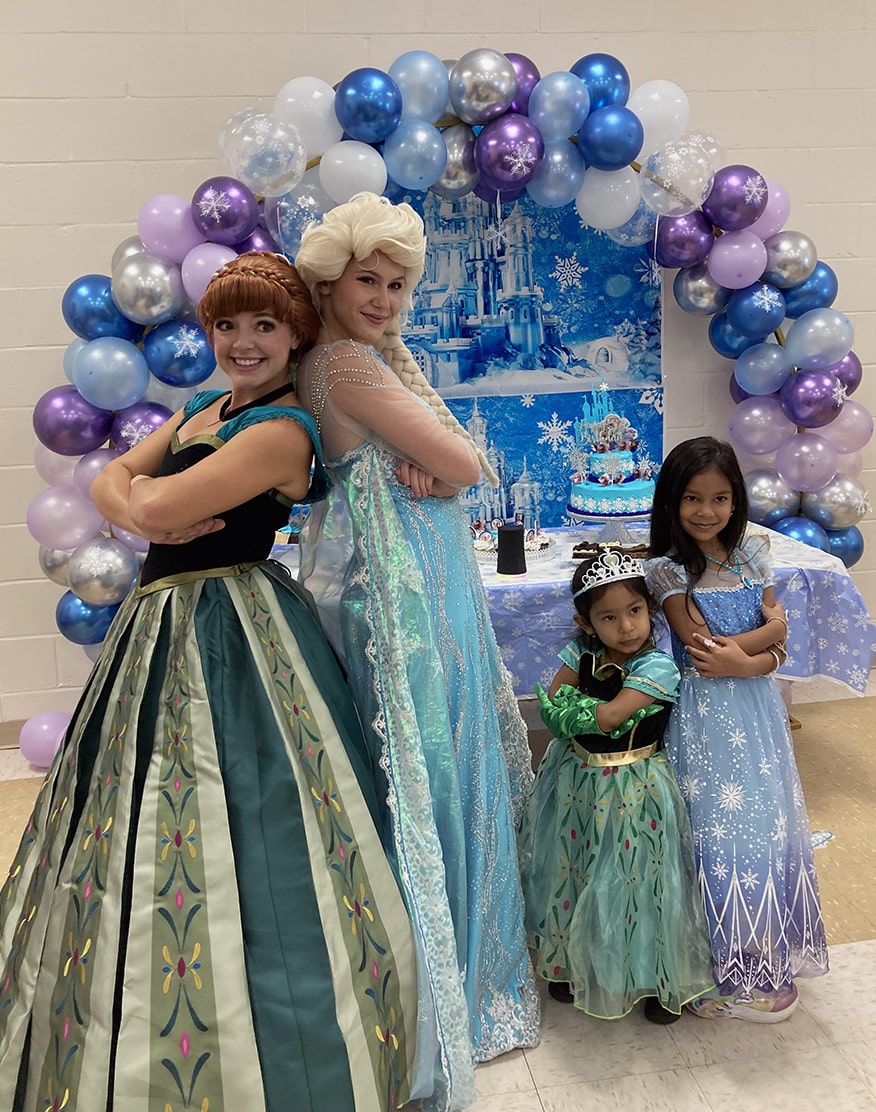 snow sisters and happy snowman at birthday party