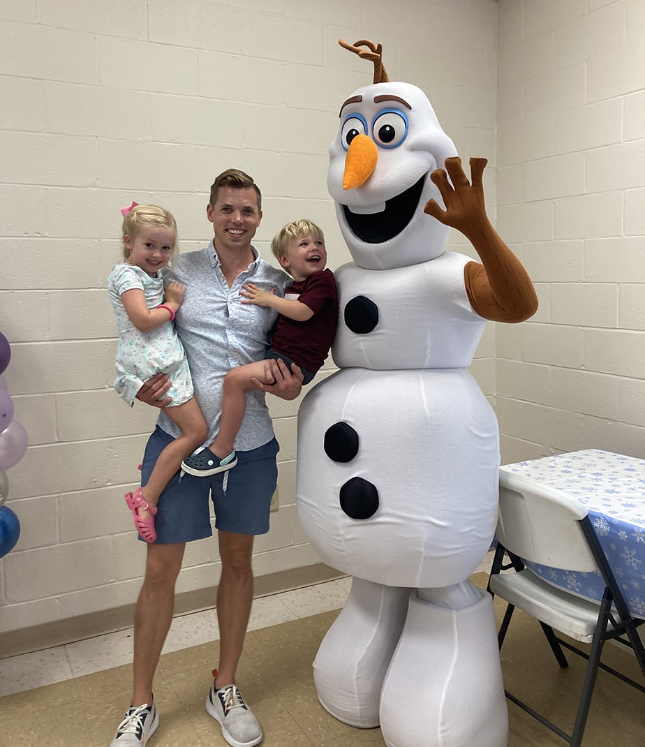 snow sisters and happy snowman at birthday party