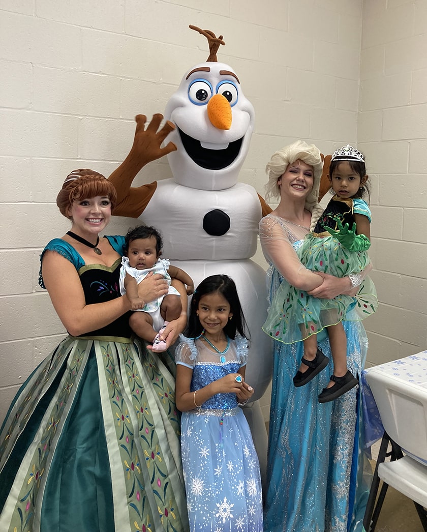 snow sisters and happy snowman at birthday party