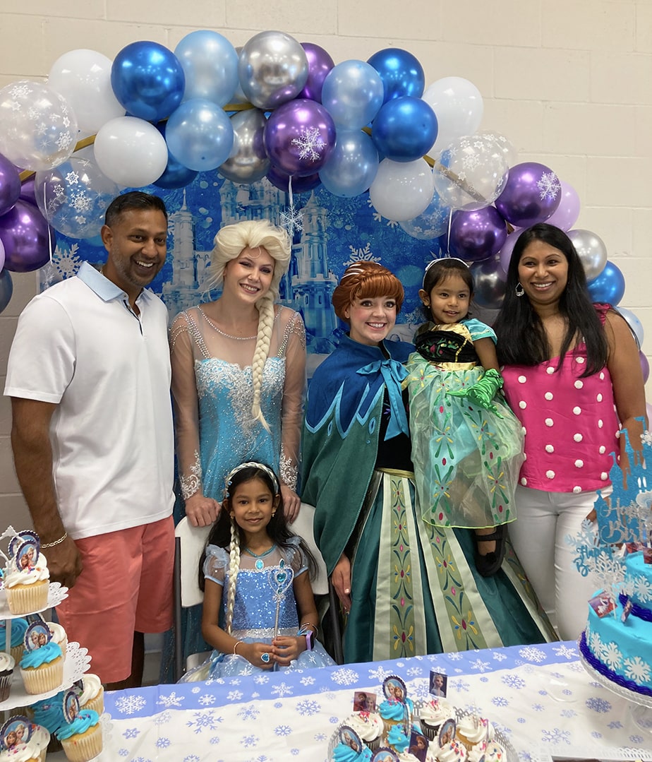 snow sisters and happy snowman at birthday party