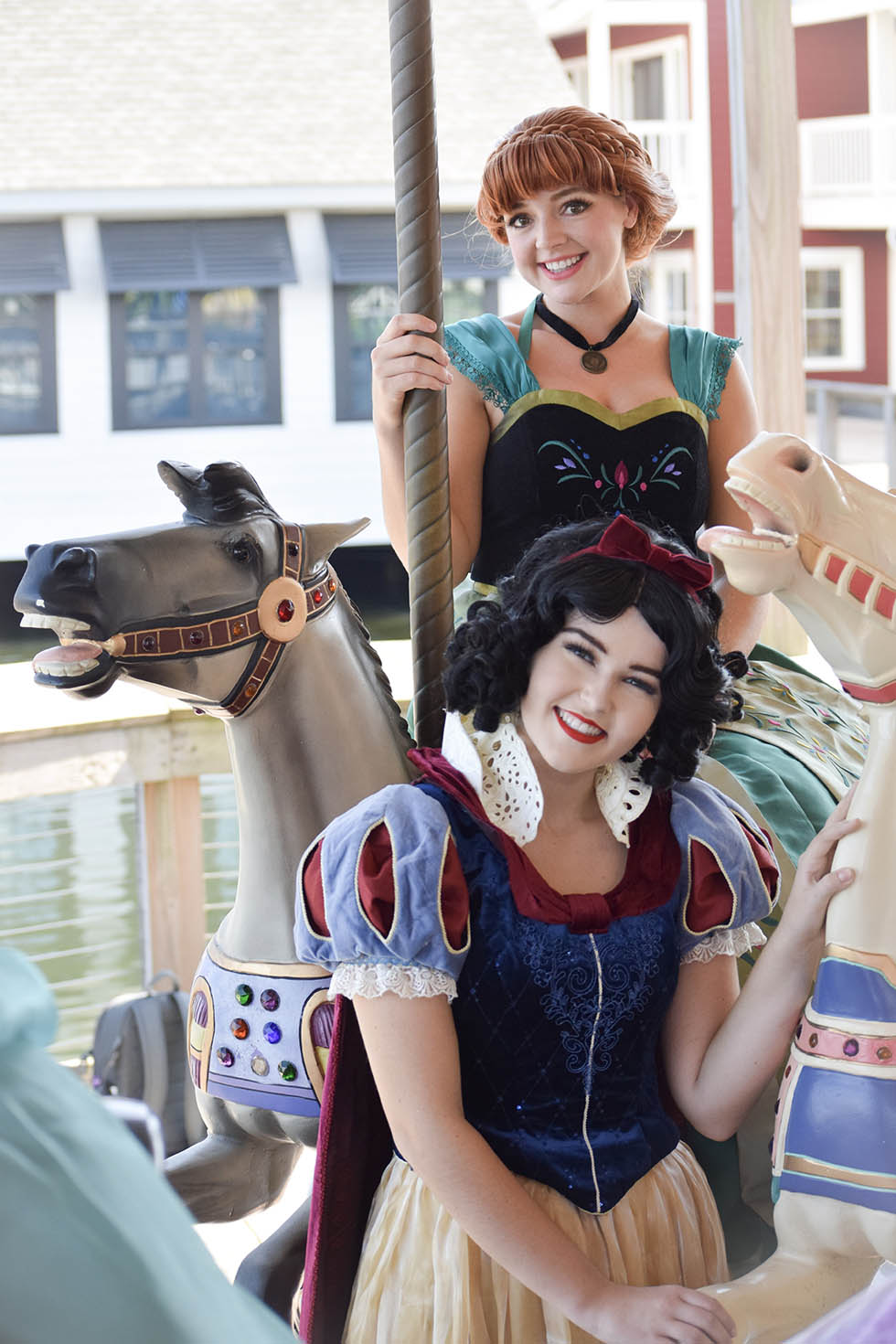 anna and snow white princess characters on carousel